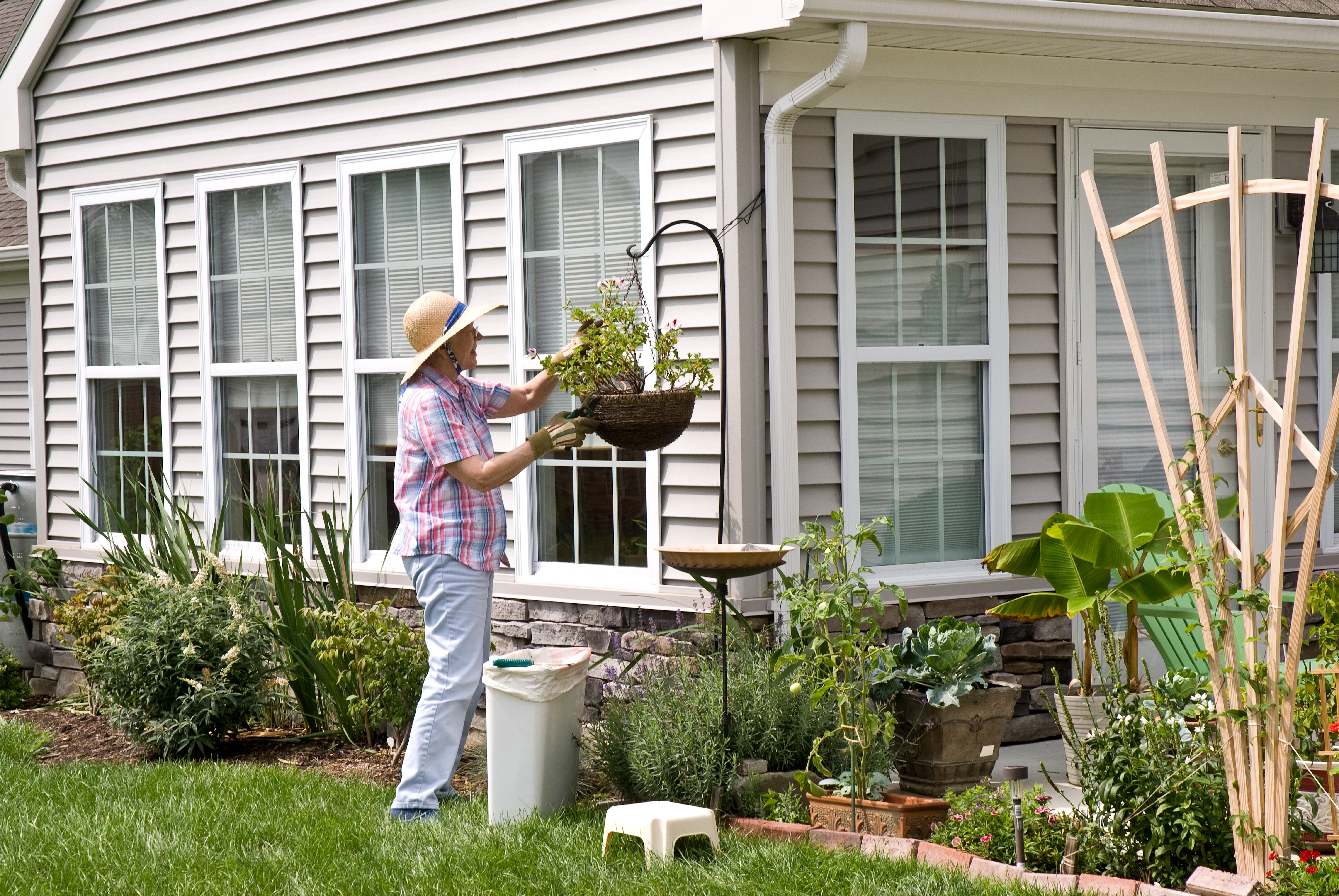 Woman tending to plants outdoors